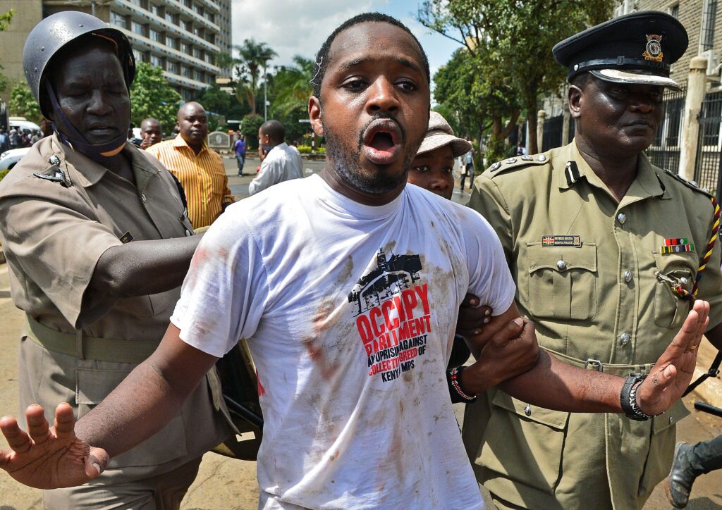 DCI Seeks To Detain Boniface Mwangi And Other Arrested Protesters For 21 Days