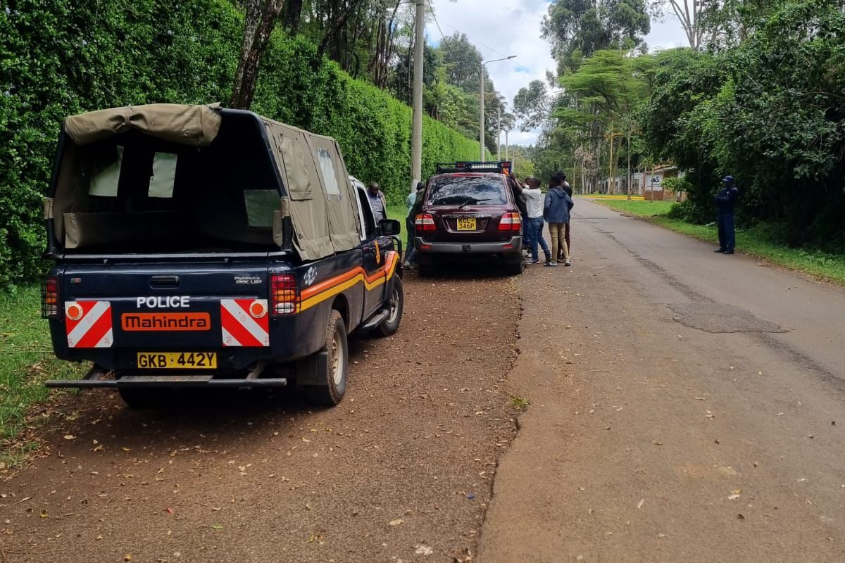 Police at the scene of the abandoned car