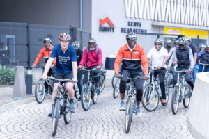 L-R:  Executive Director of Programs at World Bicycle Relief (WBR) Sean Granville-Ross and Equity Bank Kenya Managing Director Moses Nyabanda lead a team of staff from Equity Bank Kenya in a cycling exercise held to mark the beginning of the partnership that seeks to boost access to affordable mobility, physical fitness and support economic empowerment. Equity Bank will support access to the bicycles through its asset financing solution.